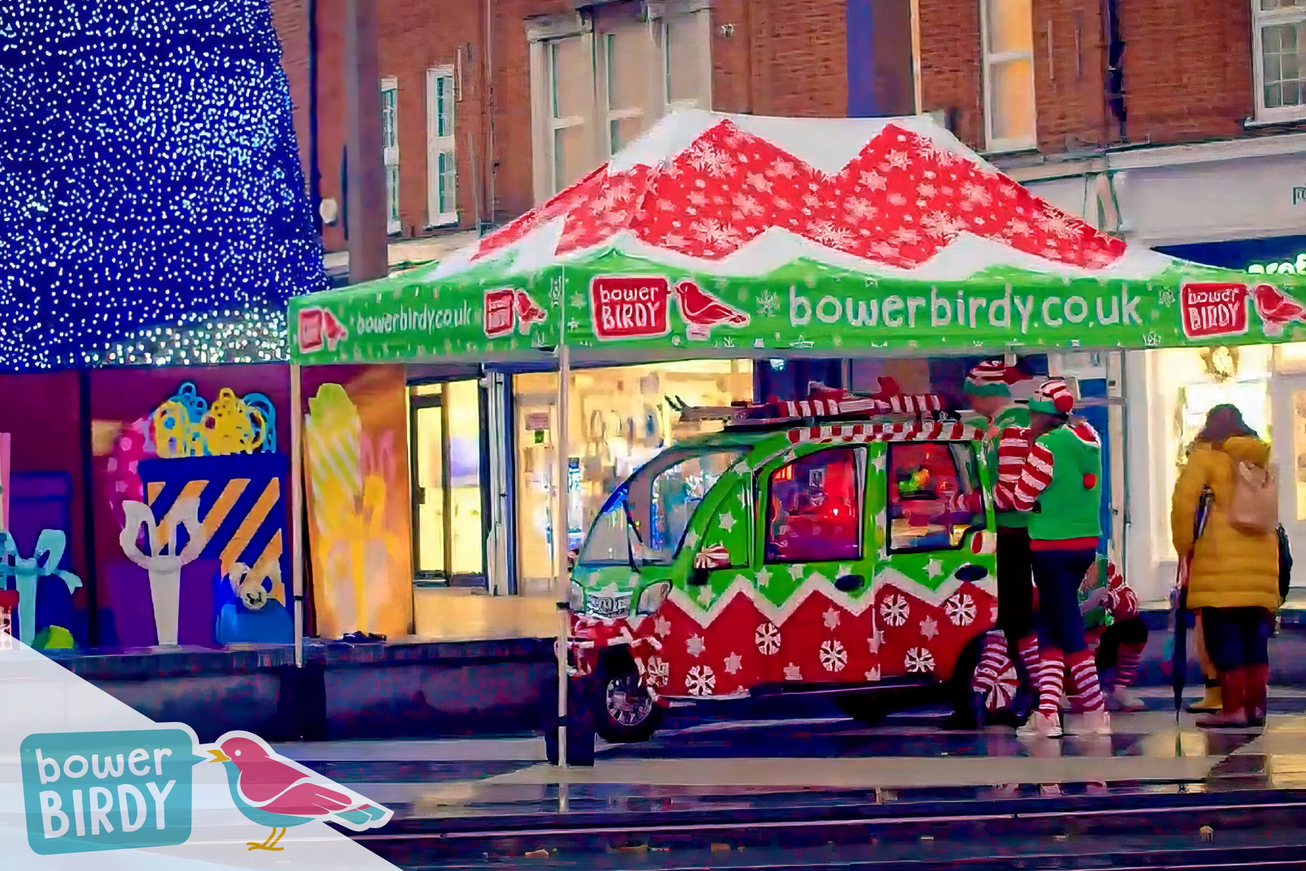 Bowerbirdy's Elf Car under a matching red and green gazebo, next to a giant Christmas tree