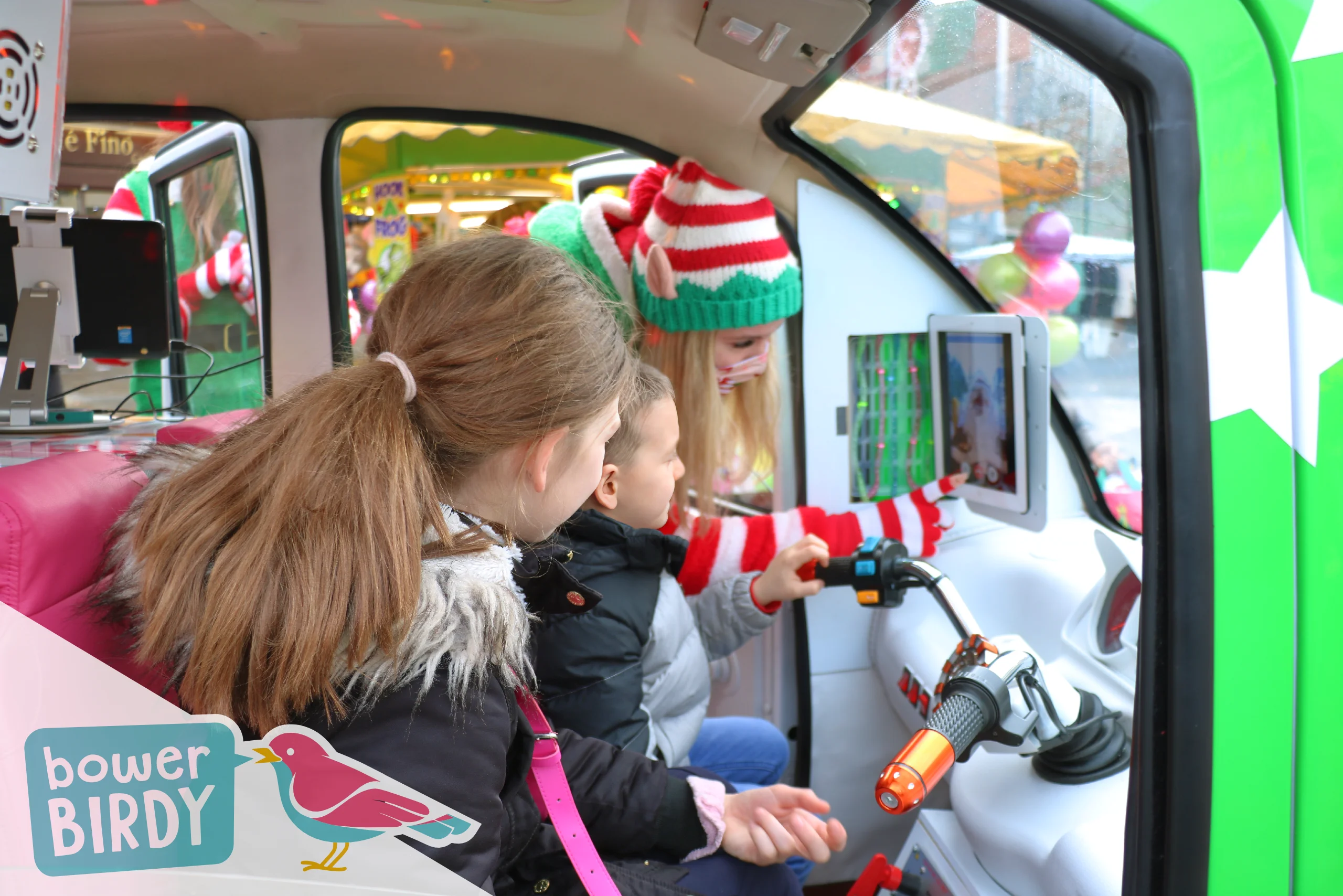 Elf Car Christmas Event: Two children video call Santa inside the Elf Car