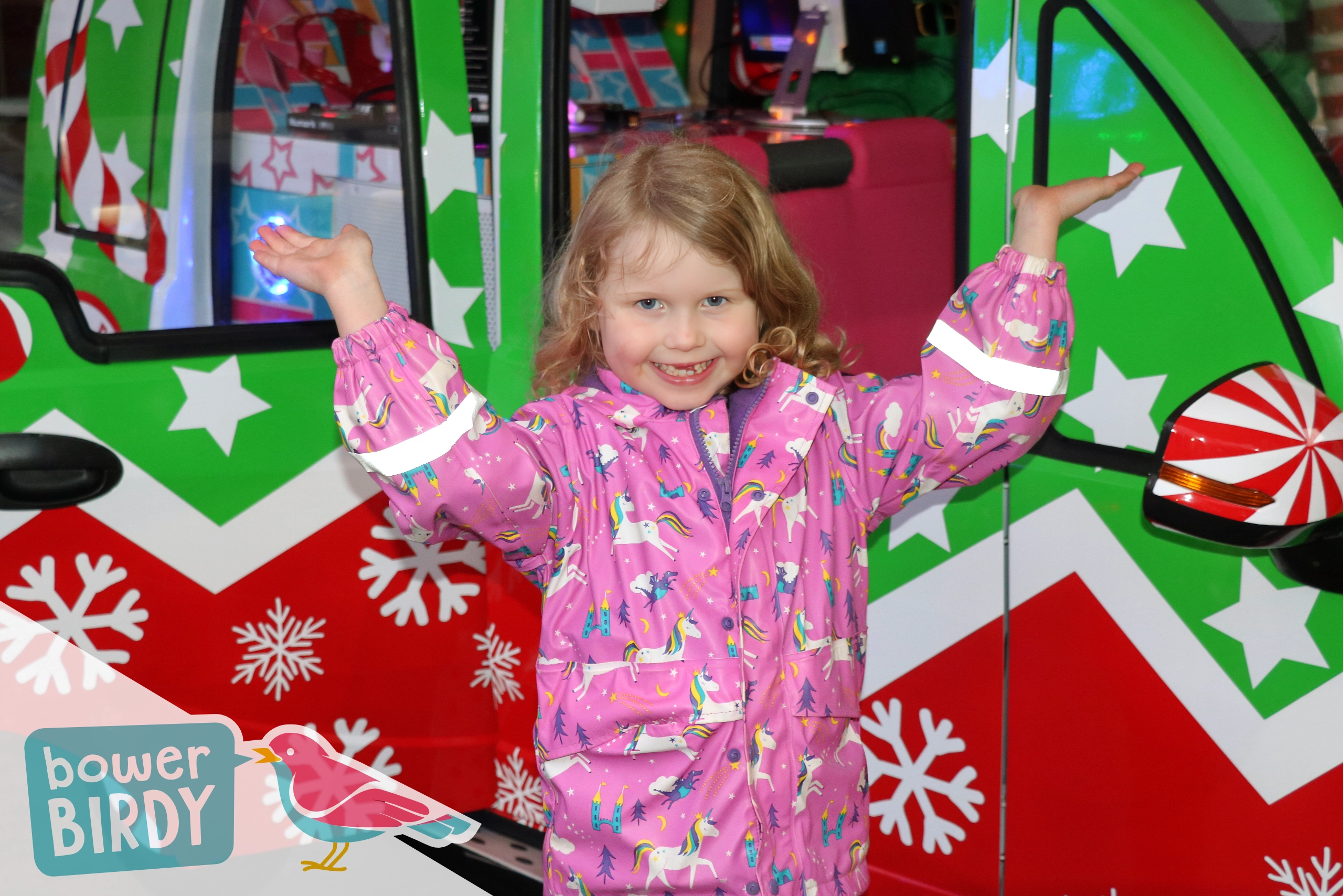 Elf Car Christmas Event : A young girl poses in front of the Elf Car