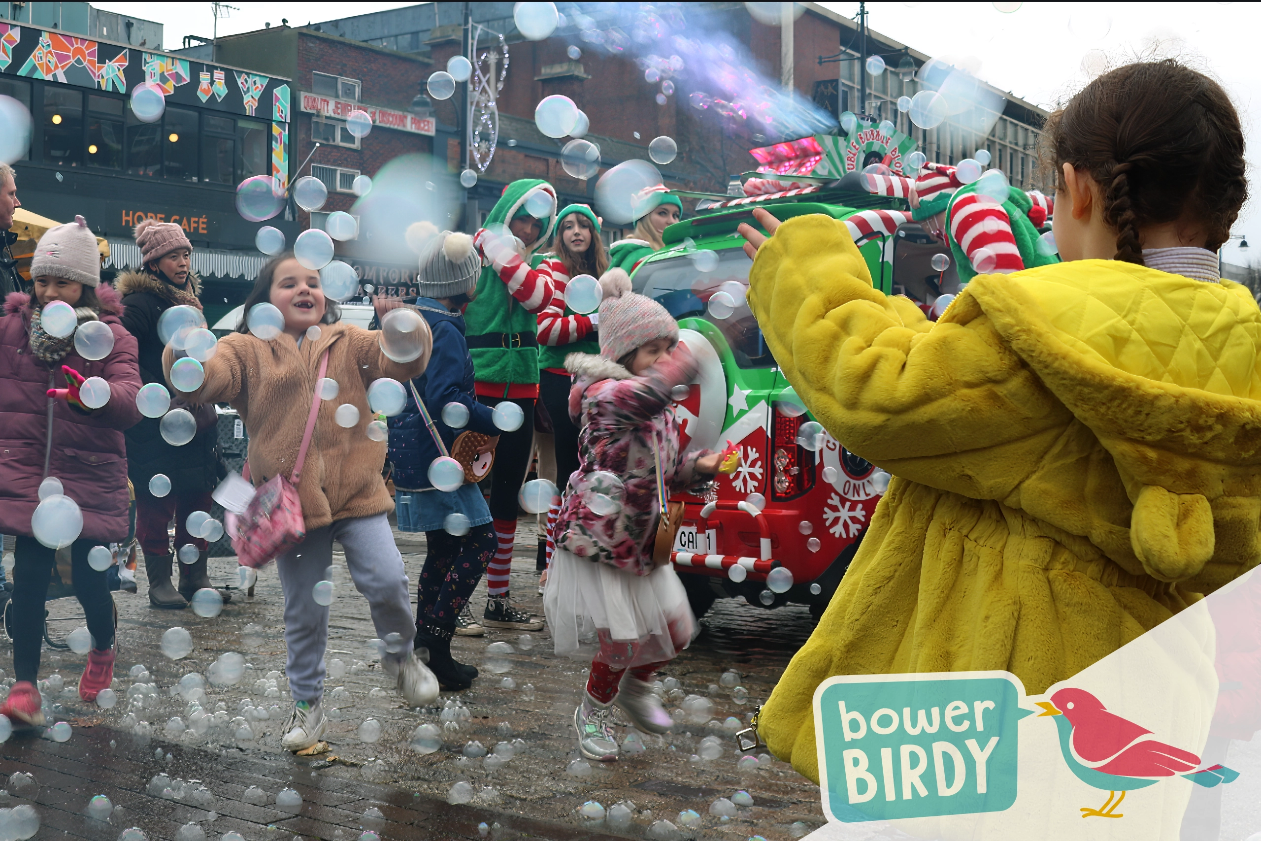 Elf Car Christmas Event: Children play in the bubbles blasting from the Elf Car