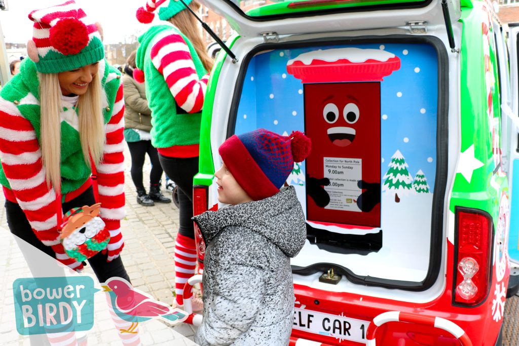 Magical Elf Car Christmas Event: A Bowerbirdy elf, young child and the animated Enchanted Postbox having fun