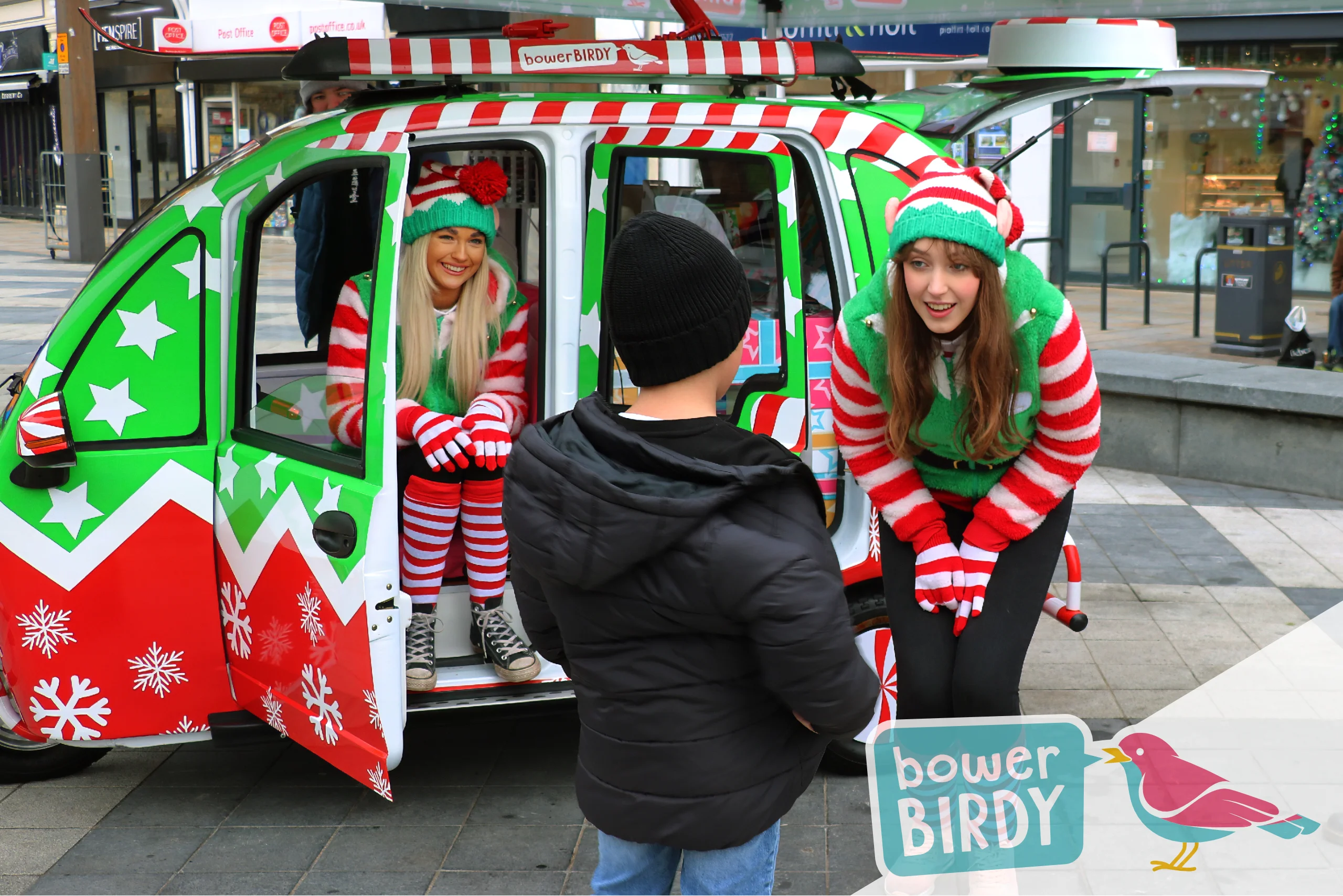 A boy talks to a Bowerbirdy elf